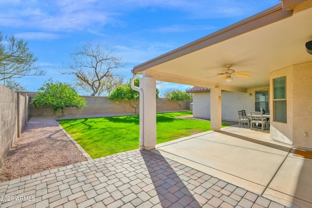 view of patio / terrace with a fenced backyard and ceiling fan