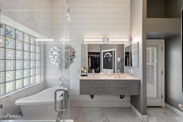 7925 E Osage Ave, Mesa, AZ 85212 - full bath with marble finish flooring, a freestanding tub, double vanity, and baseboards