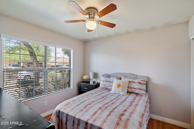7925 E Osage Ave, Mesa, AZ 85212 - bedroom featuring baseboards, wood finished floors, and a ceiling fan