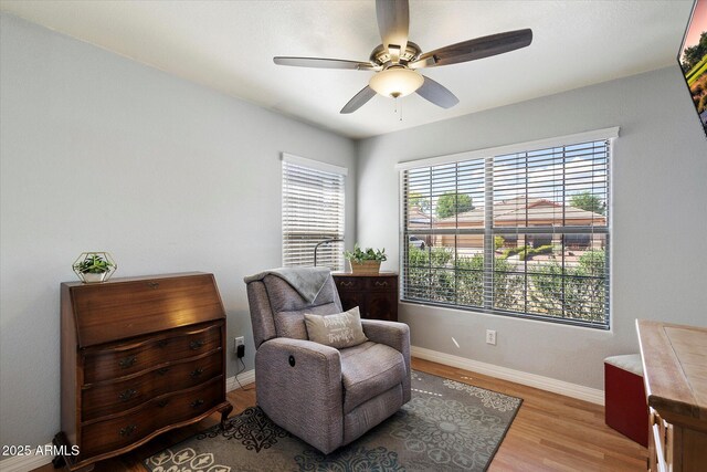 7925 E Osage Ave, Mesa, AZ 85212 - living area featuring a ceiling fan, plenty of natural light, wood finished floors, and baseboards