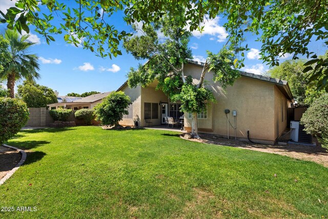7925 E Osage Ave, Mesa, AZ 85212 - rear view of property featuring stucco siding, central AC, and a patio area