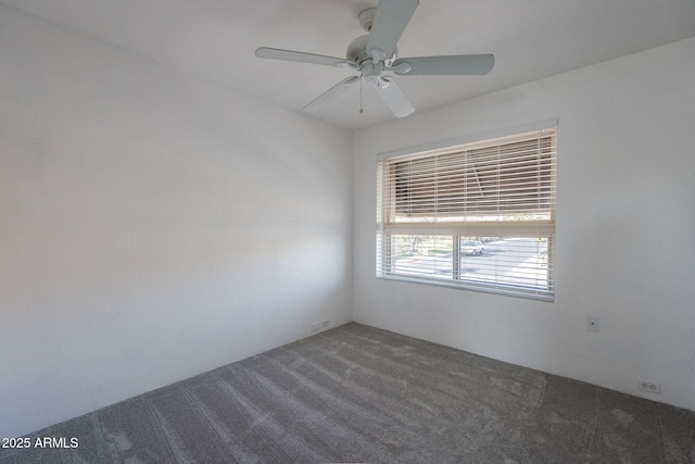 empty room featuring carpet floors and ceiling fan