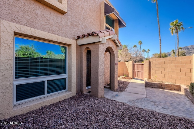 entrance to property featuring a patio area