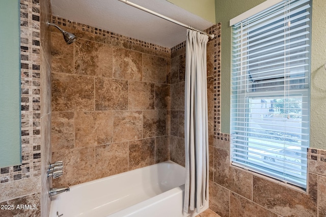 bathroom with shower / tub combo