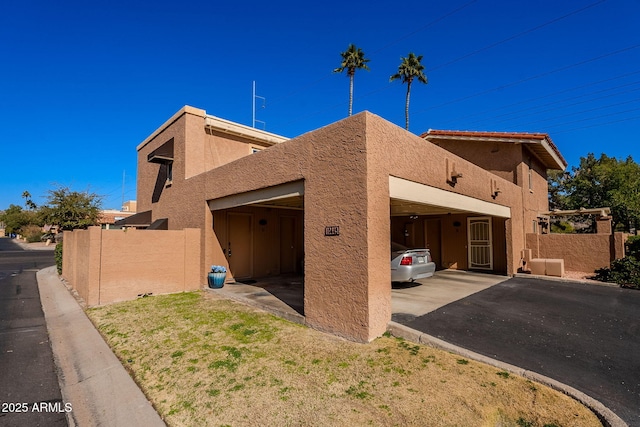 view of home's exterior featuring a carport