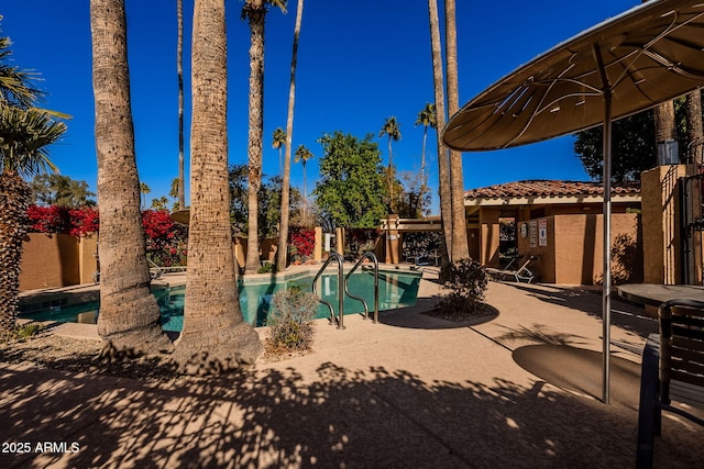 view of pool featuring a patio area