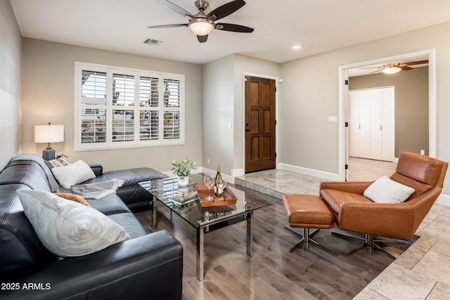 living room featuring recessed lighting, visible vents, ceiling fan, and baseboards