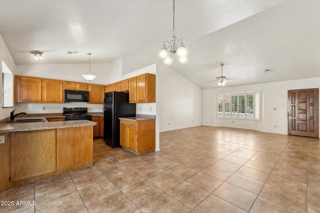 kitchen featuring lofted ceiling, a sink, a peninsula, open floor plan, and black appliances