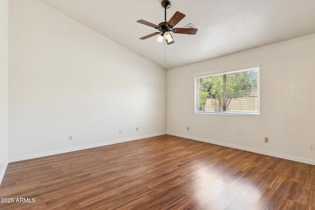 spare room with baseboards, wood finished floors, lofted ceiling, and ceiling fan