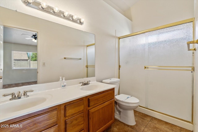 bathroom with a stall shower, tile patterned floors, toilet, and a sink