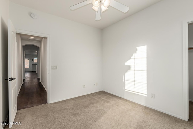 empty room with carpet and ceiling fan