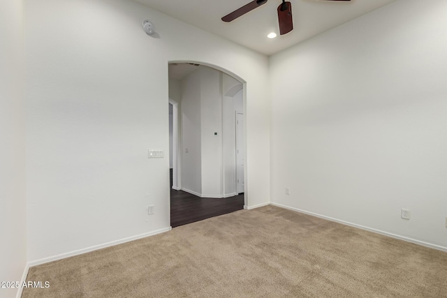 empty room with ceiling fan and carpet