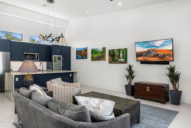 11649 N Miller Rd, Scottsdale, AZ 85260 - living room with baseboards, visible vents, a high ceiling, and recessed lighting