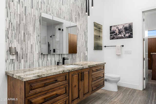 11649 N Miller Rd, Scottsdale, AZ 85260 - full bathroom featuring toilet, vanity, a stall shower, and baseboards