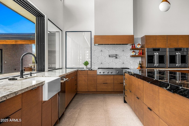 11649 N Miller Rd, Scottsdale, AZ 85260 - kitchen featuring stainless steel appliances, brown cabinetry, and custom exhaust hood