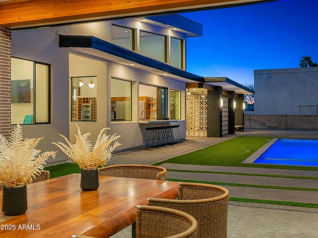 11649 N Miller Rd, Scottsdale, AZ 85260 - rear view of property featuring stucco siding, a patio, and a sink