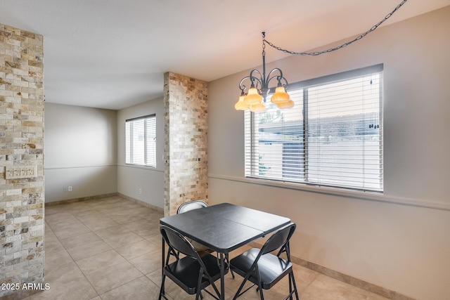 8225 N Central Ave Unit 44, Phoenix, AZ 85020 - dining space featuring baseboards, an inviting chandelier, and light tile patterned floors