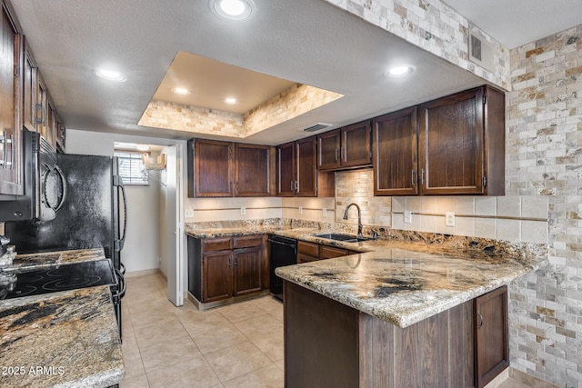 8225 N Central Ave Unit 44, Phoenix, AZ 85020 - kitchen with light stone counters, a sink, black dishwasher, a peninsula, and visible vents