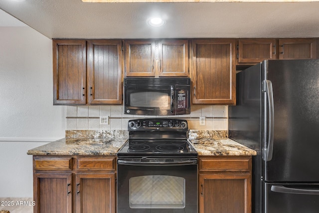 8225 N Central Ave Unit 44, Phoenix, AZ 85020 - kitchen with stone counters, backsplash, and black appliances