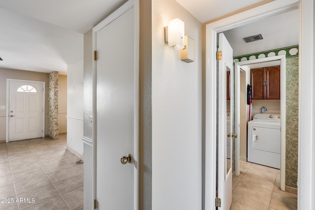 8225 N Central Ave Unit 44, Phoenix, AZ 85020 - hall featuring washer / clothes dryer, baseboards, visible vents, and light tile patterned floors