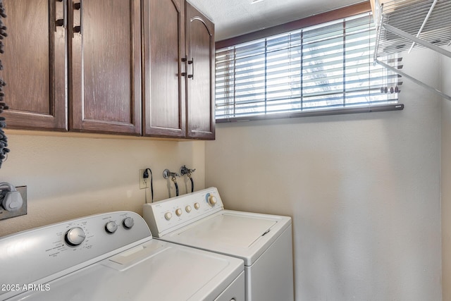 8225 N Central Ave Unit 44, Phoenix, AZ 85020 - laundry area with washer and dryer, a healthy amount of sunlight, and cabinet space