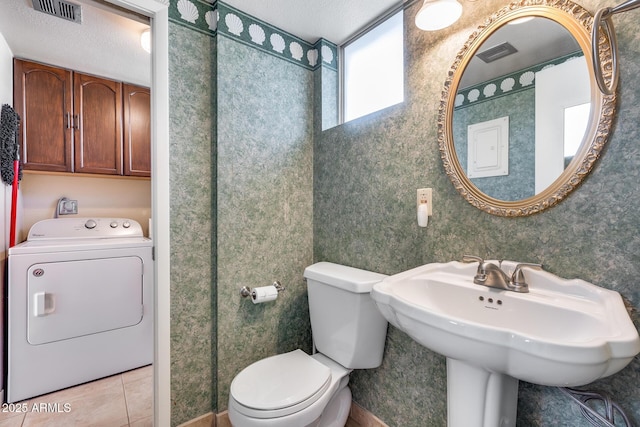 8225 N Central Ave Unit 44, Phoenix, AZ 85020 - bathroom with visible vents, washer / dryer, tile patterned flooring, and toilet