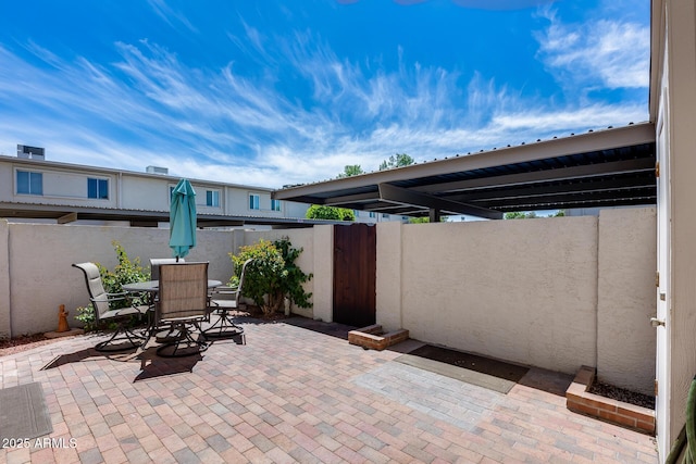 8225 N Central Ave Unit 44, Phoenix, AZ 85020 - view of patio / terrace with fence, a gate, and outdoor dining space