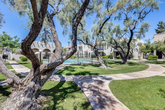 8225 N Central Ave Unit 44, Phoenix, AZ 85020 - surrounding community with a yard, fence, and a pool