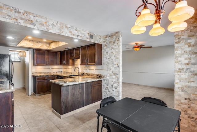 8225 N Central Ave Unit 44, Phoenix, AZ 85020 - kitchen with a peninsula, ceiling fan, light tile patterned floors, and a sink