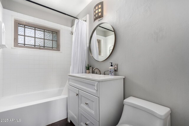 3031 E Avalon Dr, Phoenix, AZ 85016 - bathroom with toilet, vanity, and shower / bath combination with curtain