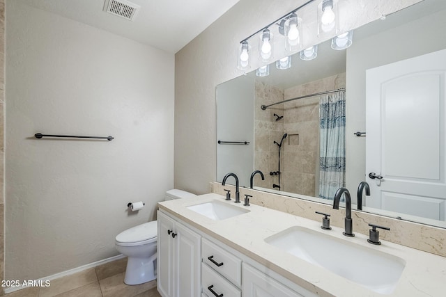 2178 E Golf Ave, Tempe, AZ 85282 - bathroom featuring toilet, tiled shower, double vanity, and tile patterned floors