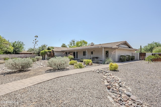 2178 E Golf Ave, Tempe, AZ 85282 - ranch-style house featuring a gate, stucco siding, and a chimney