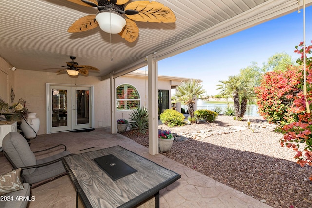 view of patio / terrace featuring ceiling fan and french doors