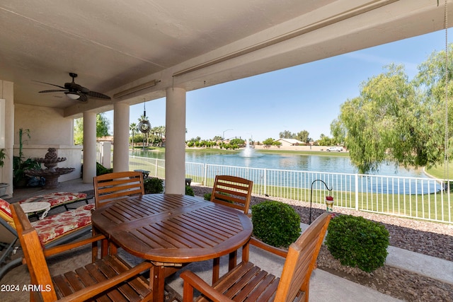 view of patio / terrace with ceiling fan and a water view