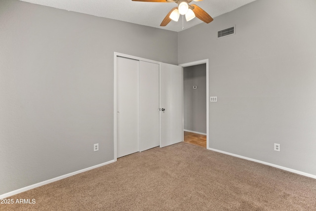 12455 N 71st Ave, Peoria, AZ 85381 - unfurnished bedroom with baseboards, visible vents, carpet, a ceiling fan, and a closet