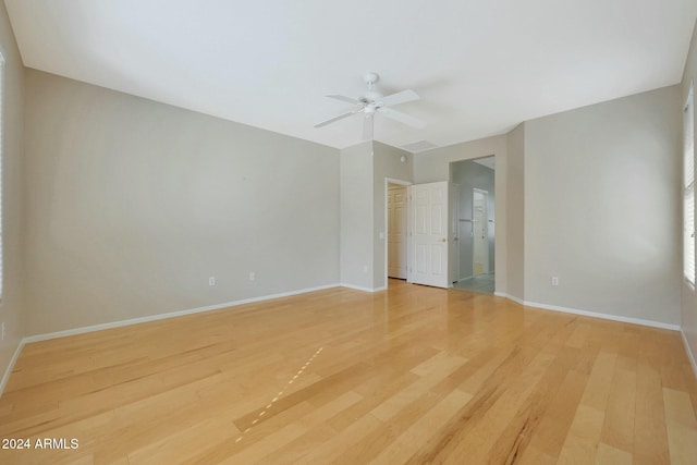 unfurnished room with light hardwood / wood-style flooring and ceiling fan