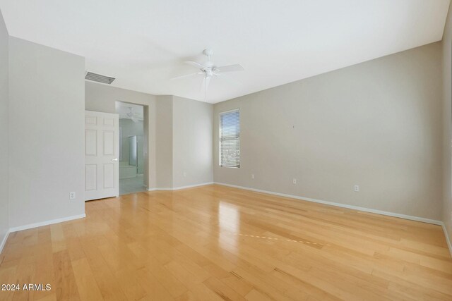 empty room featuring light hardwood / wood-style flooring and ceiling fan