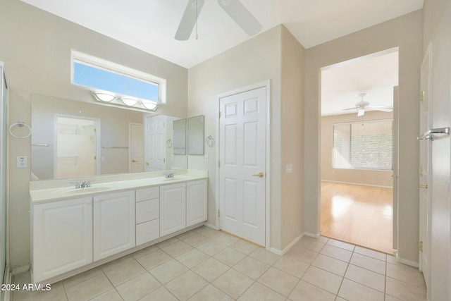 bathroom featuring tile patterned flooring, vanity, and ceiling fan