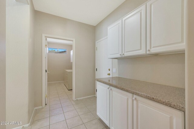 interior space featuring light tile patterned floors