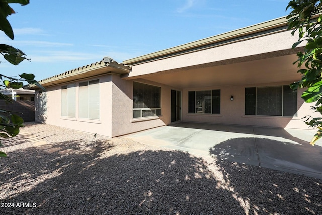 rear view of house featuring a patio area