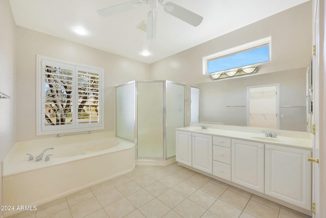 bathroom featuring vanity, ceiling fan, tile patterned flooring, and plus walk in shower