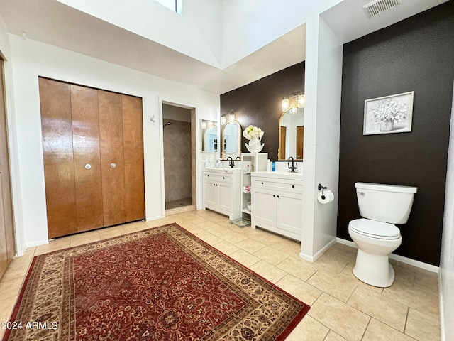 bathroom featuring tile patterned floors, vanity, and toilet