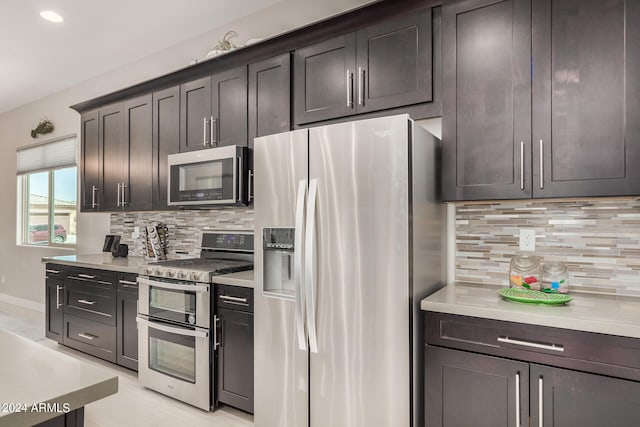 kitchen with decorative backsplash, stainless steel appliances, and dark brown cabinetry