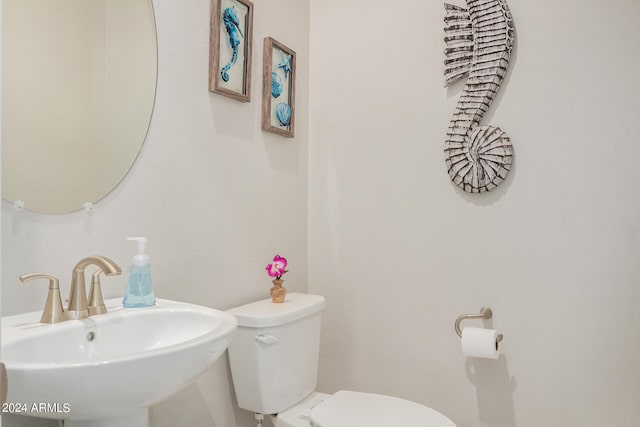 bathroom featuring sink and toilet