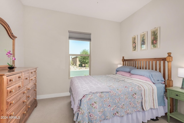 bedroom featuring light colored carpet