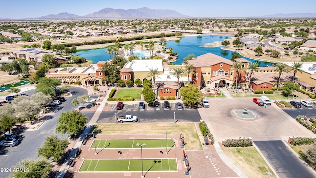 birds eye view of property with a water and mountain view