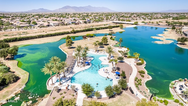 birds eye view of property featuring a water and mountain view