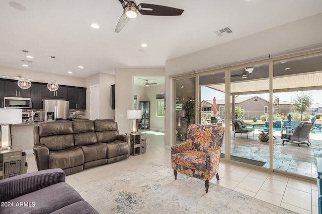 tiled living room featuring ceiling fan