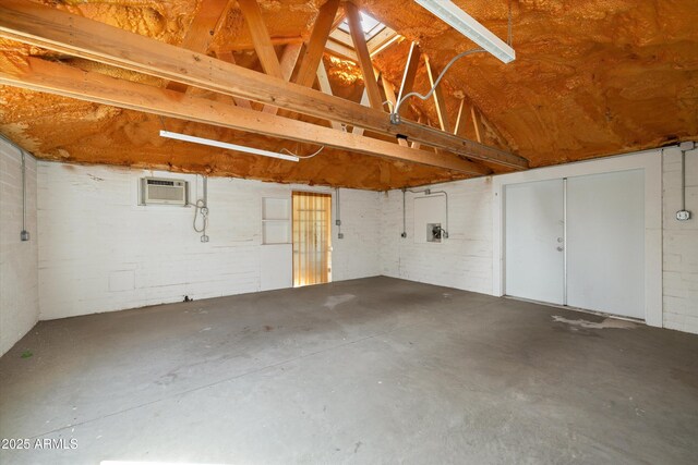 garage with an AC wall unit