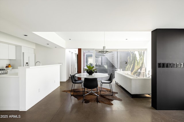 dining space with finished concrete flooring